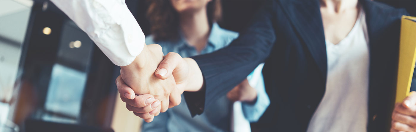 executives shaking hands after a meeting