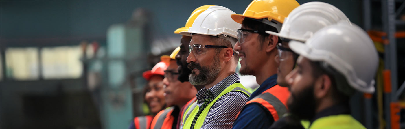 diverse group of employees in hard hats